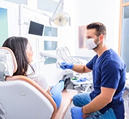 Dentist and patient talking in dental office