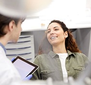 Patient and dentist talking during consultation